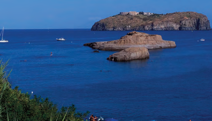 The coast of Ventotene island with a rocky islet offshore