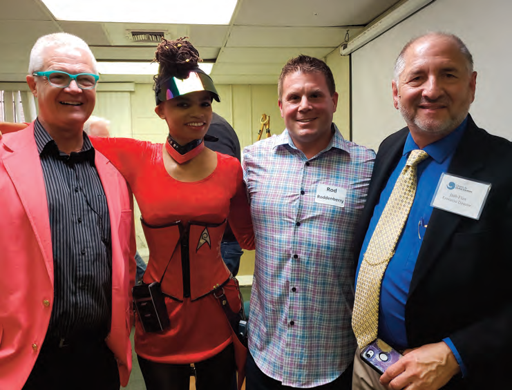 Attendees pose with a costumed guest at the CGS Annual Meeting