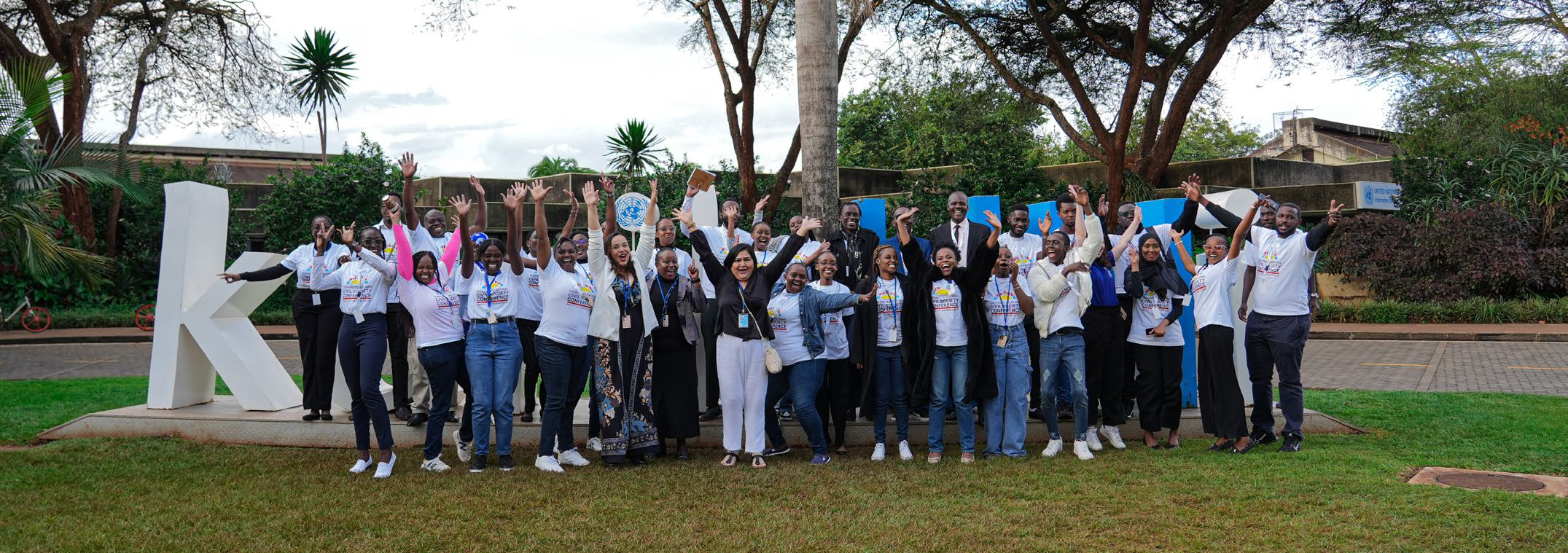 Participants wave outside the United Nations office in Nairobi