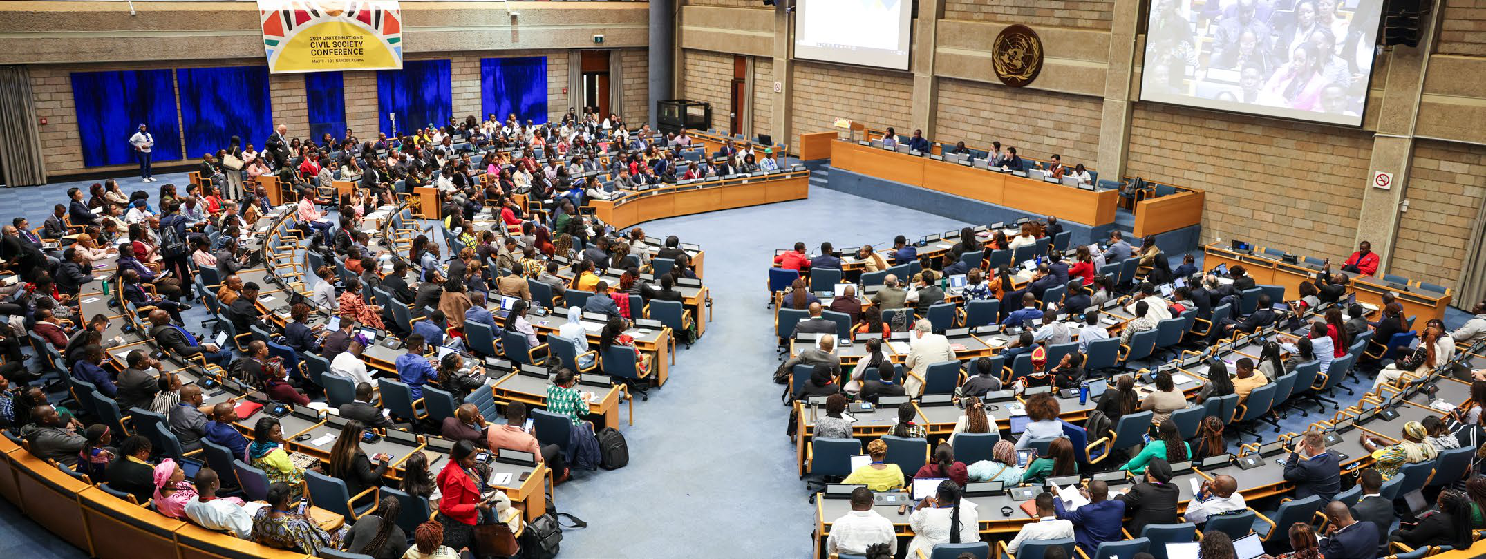 Delegates fill a United Nations assembly hall during a plenary session