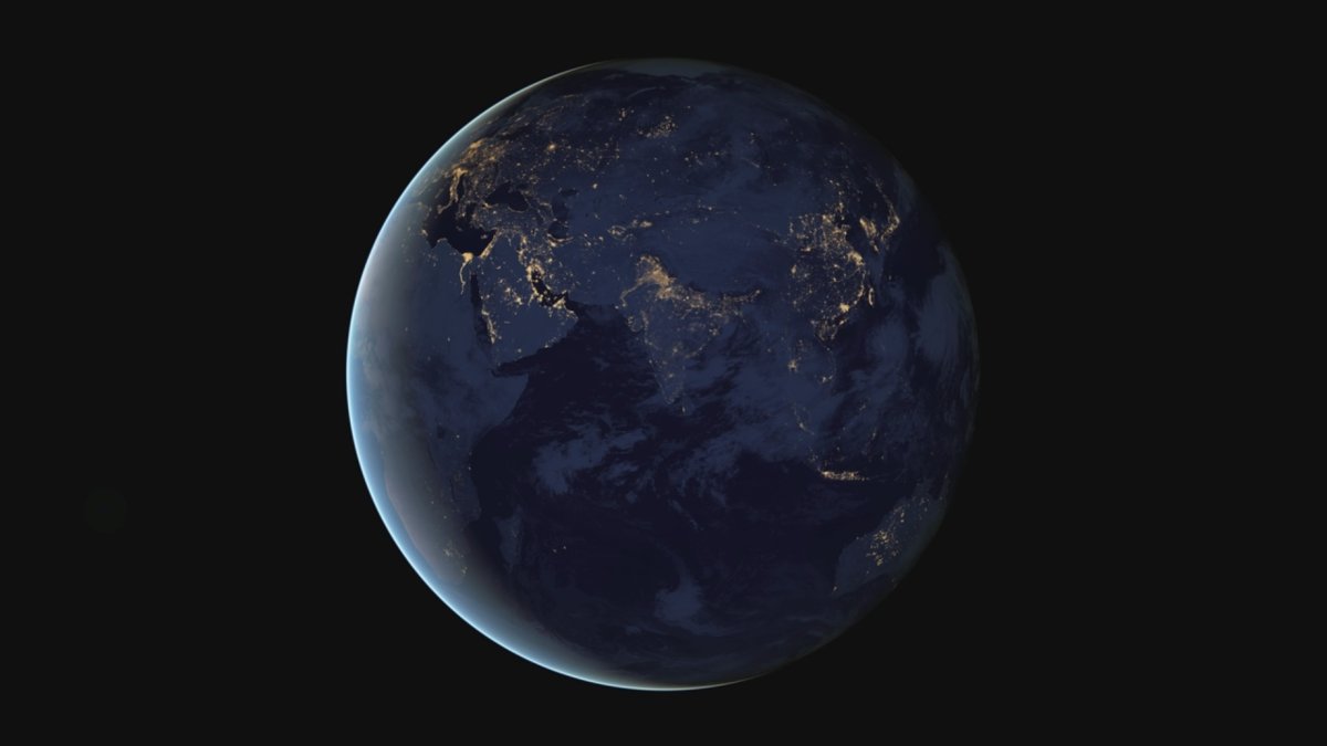 Earth at night seen from space (NASA Black Marble), city lights tracing human settlement across the continents, a conceptual image of global human development and where opportunity and freedom are unevenly spread.