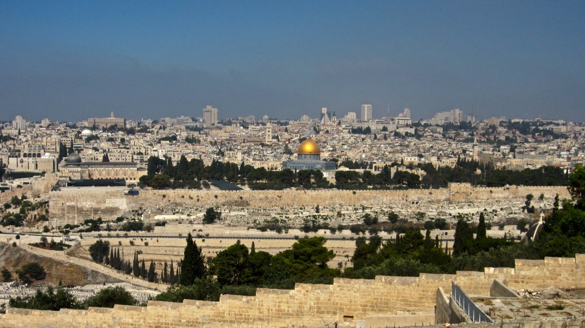 The Old City of Jerusalem skyline with the Dome of the Rock, viewed from the Mount of Olives, the concrete contested ground at the heart of the Israel-Palestine conflict.