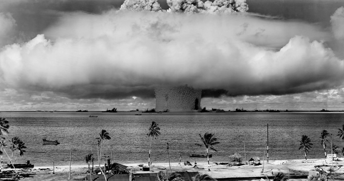 A dramatic historical nuclear detonation over the Pacific (Operation Crossroads, Baker shot), a stark emblem of the nuclear danger the article invokes amid its call for global governance fit for humanity.