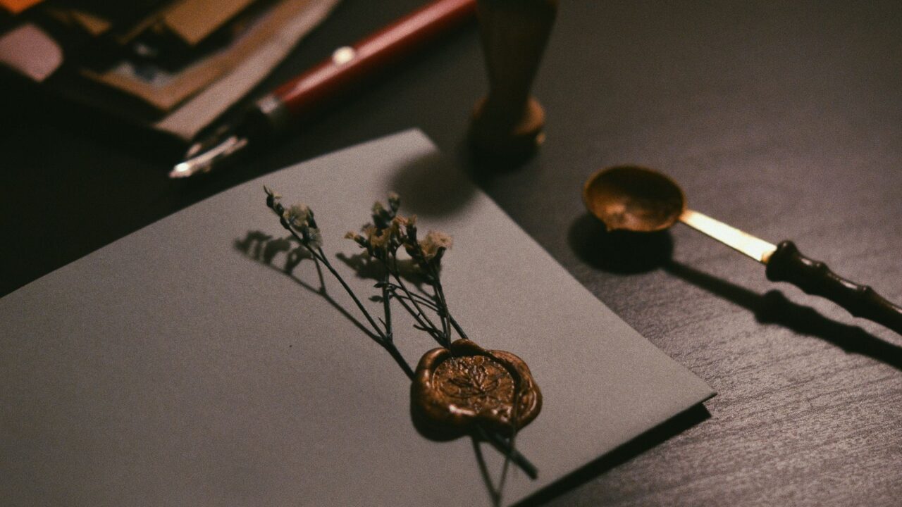 Handcrafted jewelry and decorative elements on a workbench.
