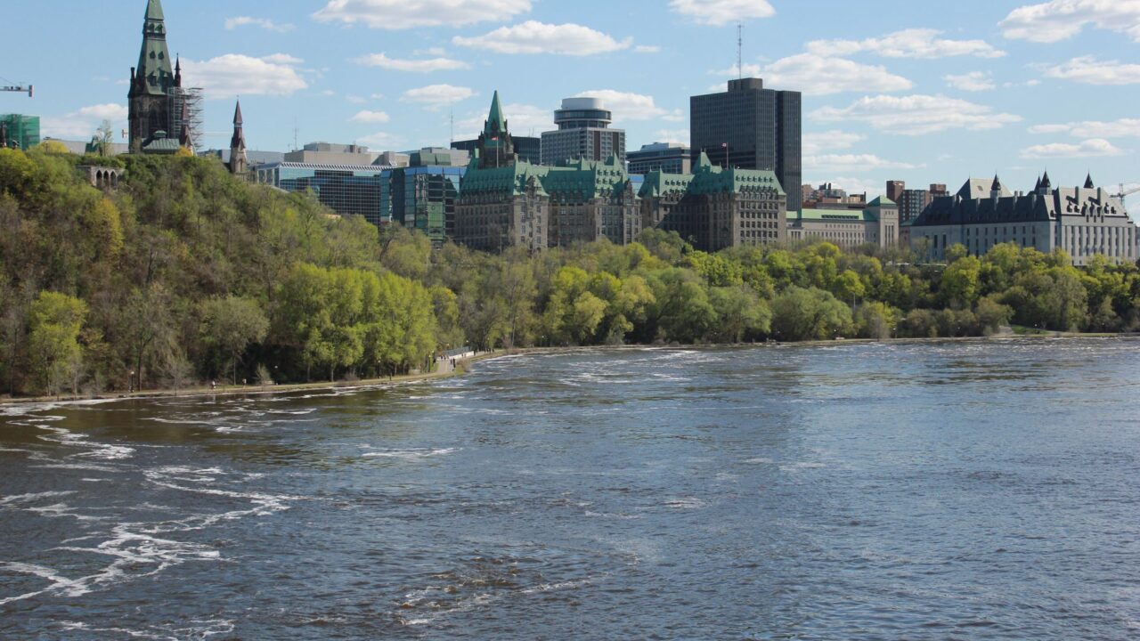 The Ottawa River with Parliament and the city skyline on the far bank.
