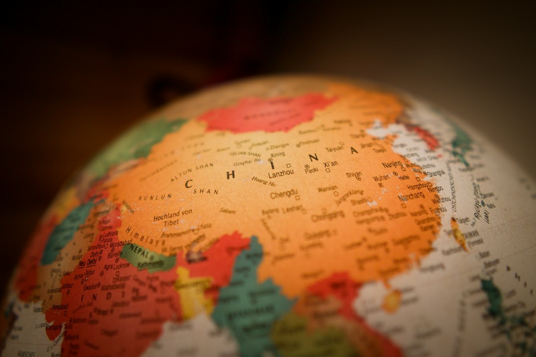 The globe is a representation of the world, showing countries and continents.