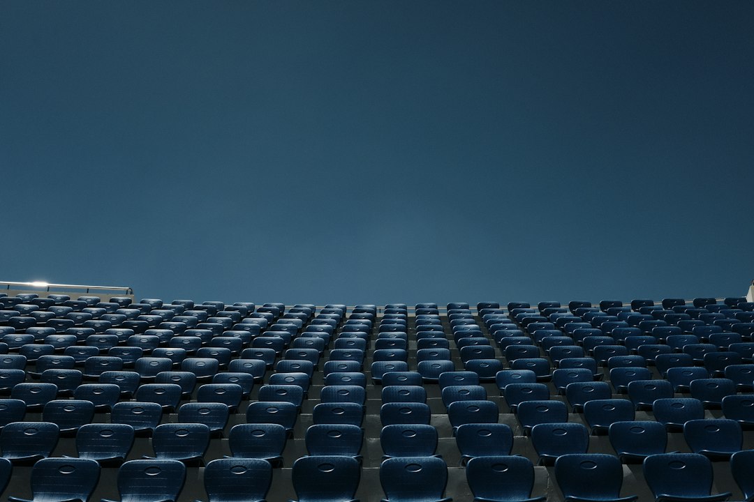 Empty seats in a stadium or arena, waiting for an event to begin.